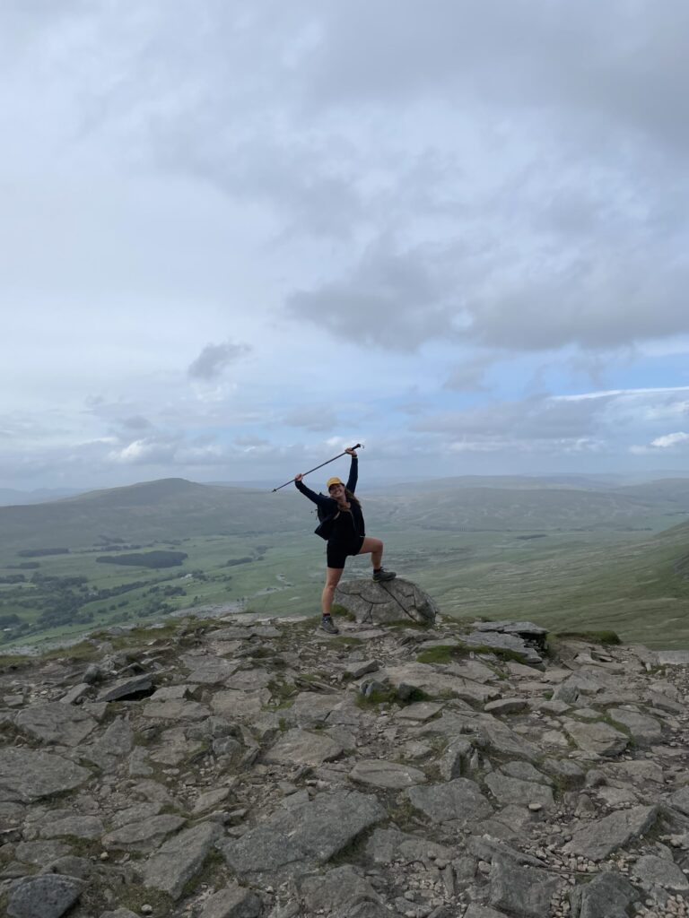 Climber on summit of Yorkshire Three Peaks during fundraising hike.